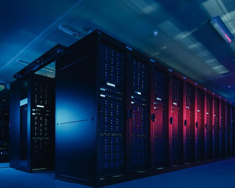 A data center with multiple rows of server racks.