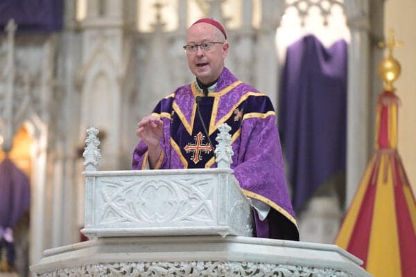 Archbishop James R. Golka during Mass earlier this year. The archbishop said he prayed about whether to accept the invitation to the White House.